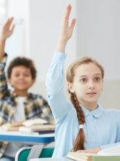children-raising-hands-in-school.jpg